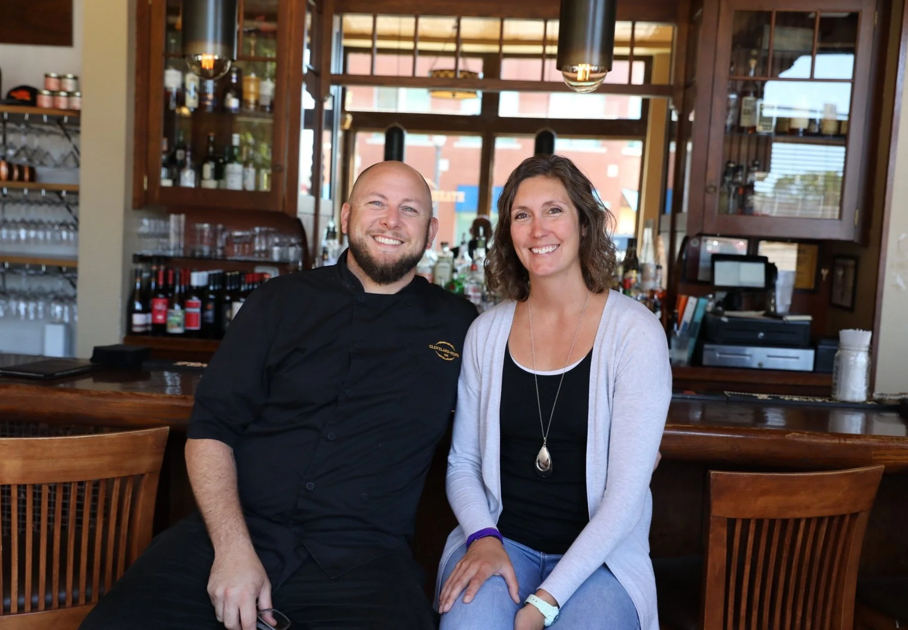 Evan and Gina Buchholz at the bar — photographed at Cleveland-Heath, placeholder until Market & Main photography is shot
